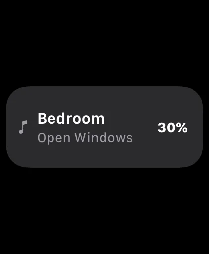 The Smart Stack card on a plain black background: a music note, Bedroom, Open Windows and 30%.