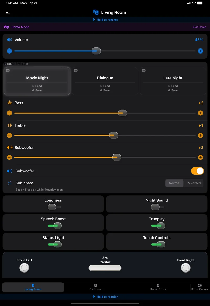 The Living Room page on an iPad in dark mode, all on one screen: Demo Mode banner, Volume 45%, Movie Night, Dialogue and Late Night presets with Movie Night lit, Bass, Treble and Subwoofer sliders, a Subwoofer switch, Sub phase Normal or Reversed, six switches for Loudness, Night Sound, Speech Boost, Trueplay, Status Light and Touch Controls, the room map with Front Left, Arc Center and Front Right, and the four room tabs.